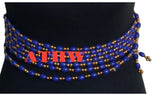 African Traditional Home and Wear Imoto waist beads featuring blue and gold cylindrical beads on a string