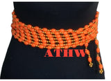African Traditional Home and Wear orange and gold beaded waist string with multi-strand design on a black mannequin